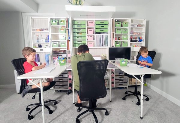 photo of 3 kids sitting at a Createroom Dreambox with 2 side tables attached