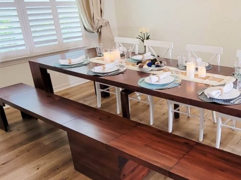 transformer table with plates set on it for dinner